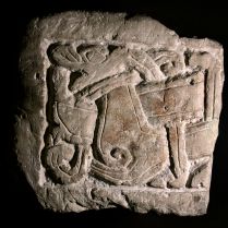 Fragment of an Anglo-Scandinavian limestone grave cover found in the archaeological dig at 16-22 Coppergate. York Archaeological Trust